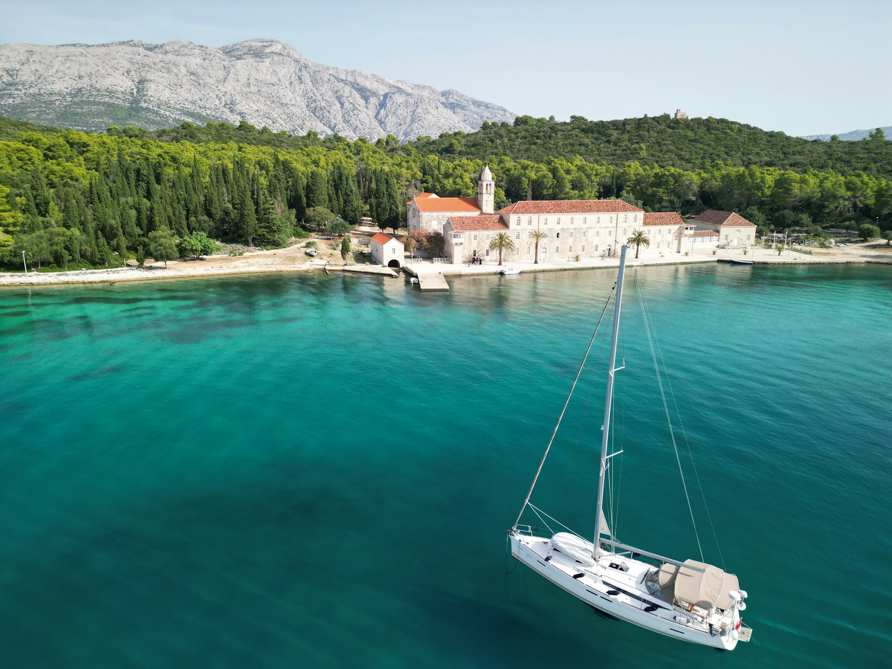 Sailboat anchored in clear Adriatic water off Korčula, Croatia