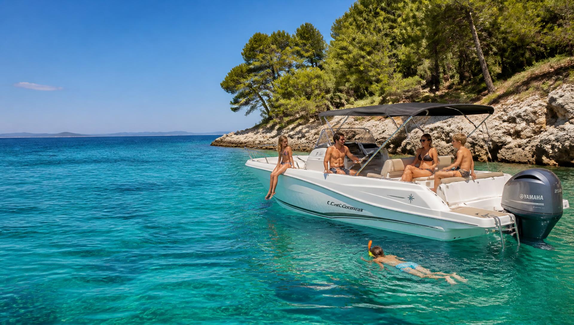 Small day boat anchored in a clear turquoise Croatian cove